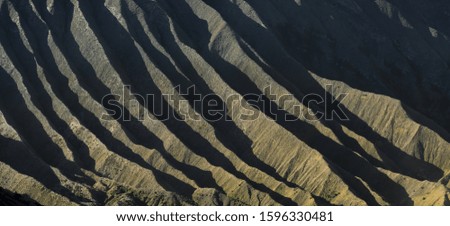 Close-up view of the slopes of the Mount Bromo during a beautiful sunrise. Mount Bromo is an active volcano in East Java, Indonesia.