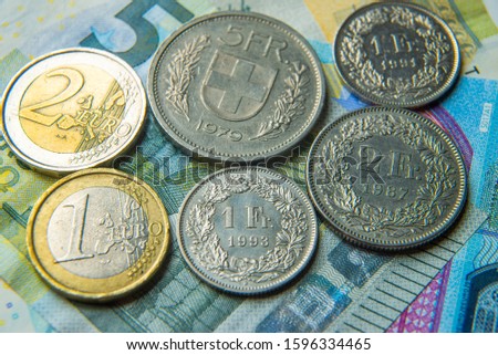 Euro and Swiss Franc coins and banknotes
