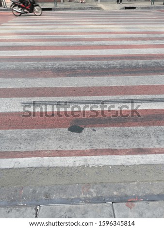 Zebra crossing with car in thailand