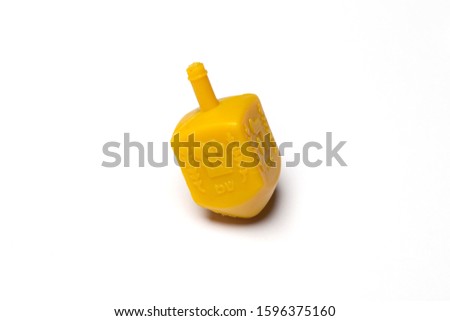 Hanukkah Jewish holiday image with a collection of wooden dreidels (spinning top) on a white background
