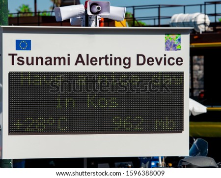 Tsunami alarm sign scoreboard for seaquakes warning in Kos town on the island of Kos Greece