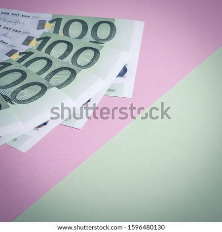 Euro cash on a pink and green background. Euro Money Banknotes. Euro Money. Euro bill. Place for text.