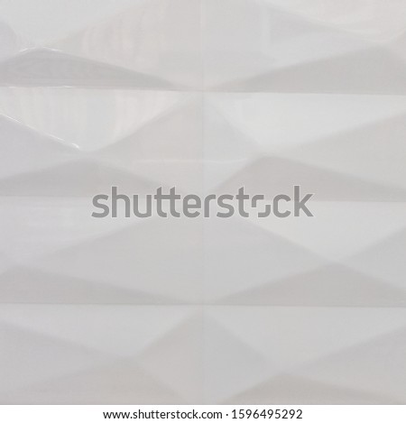 Gray ceramic tile with abstract pattern for wall decoration. Concrete stone surface background. Texture for design interior project.