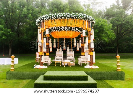 Indian wedding mandap decor yellow and white flowers Royalty-Free Stock Photo #1596574237