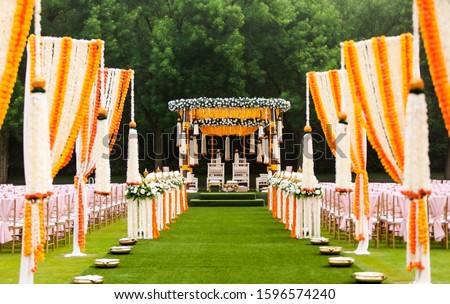 Indian wedding mandap decor yellow and white flowers Royalty-Free Stock Photo #1596574240