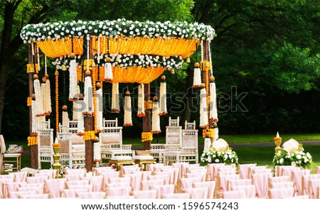 Indian wedding mandap decor yellow and white flowers Royalty-Free Stock Photo #1596574243