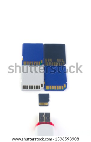 
USB flash drive and memory card in blue, white and black on a white background