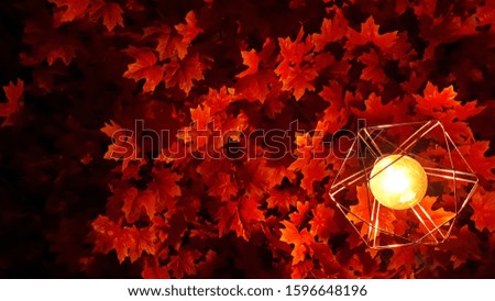 light bulb decorated with maple leaves