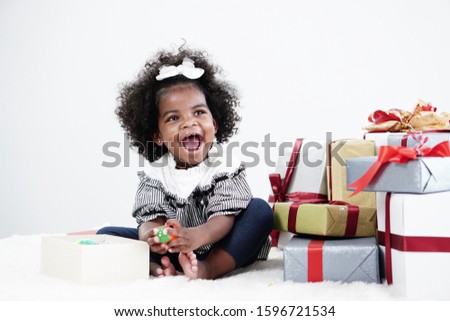 African american girl child having fun open gift box on her birthday