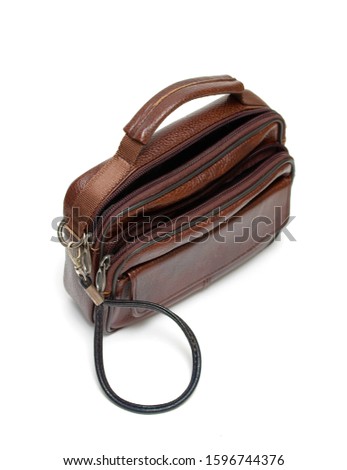 Leather brown purse bag on a white background.