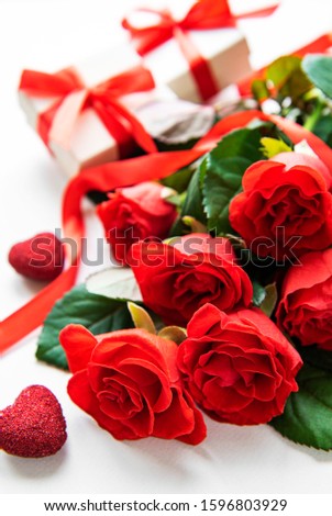 Red roses and gift boxes on a white background. Valentines concept. 