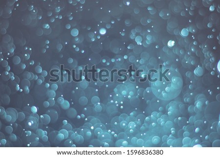 Abstract bokeh lights with light Blue background, beautiful bokeh from water droplets

