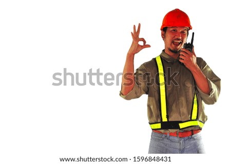 Foreman with orange safety helmet holding a walkie talkie  and showing okay sign isolated on white background.