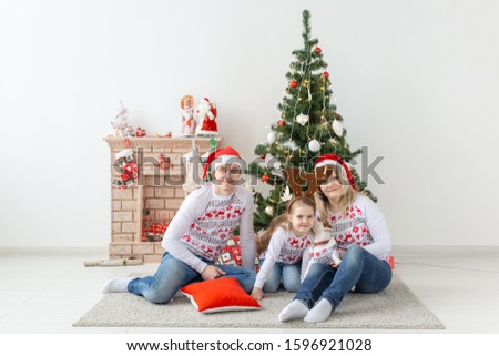 Holidays and festive concept - Happy family portrait by Christmas tree