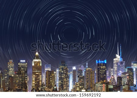new york city, midtown manhattan, view from the outside to the bright time square, with a star trails effect in the night sky, for a time concept, bound to this famous place