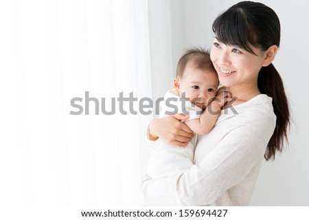young asian mother and baby Royalty-Free Stock Photo #159694427