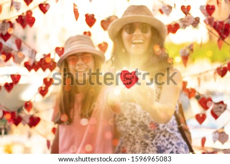 Heart Shape in the hands for celebrating St Valentine’s Day. Love concept with hearth shape