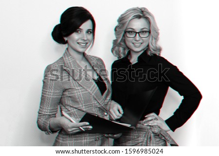 two young successful businesswoman girls with attractive smiles and documents. Monochrome photography with 3D glitch effect