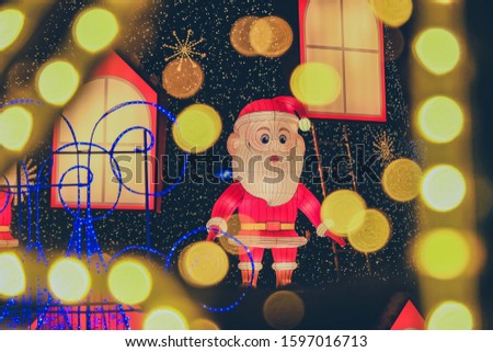 Santa's puppet in the midst of a light bulb