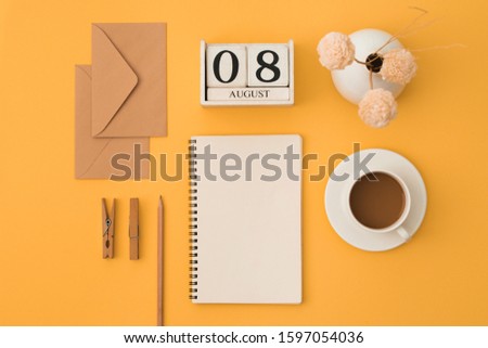 Open note, white pages, keyboard, glasses, pencil, pen, coffee on orange background. Study and working concept. Flat lay. Place for text.