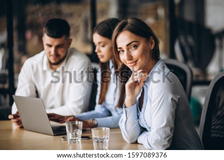 Group of people working out business plan in an office
