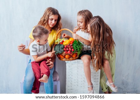 children sit with fresh vegetables healthy eating fruit