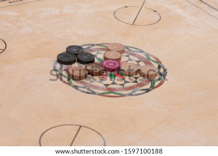 Carrom board with coins. Carrom is Indian game for 4 players 