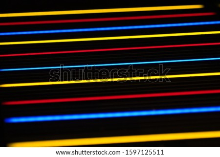 colored paralles lighting lines in dark