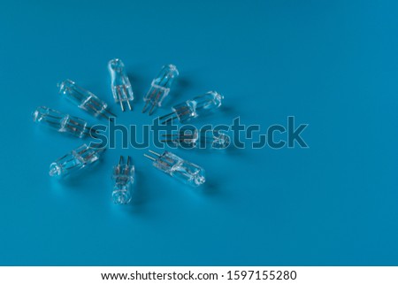 Transparent LED on a blue background. Electronic component. Diode for lighting
