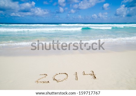 2014 year on the sand beach near the ocean