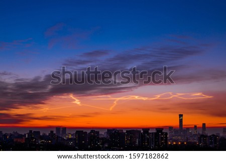 Beijing city scenery sunrise full of rosy clouds