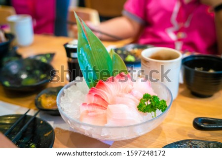 Suzuki fish sashimi in bowl on ice with appetizer japanese food