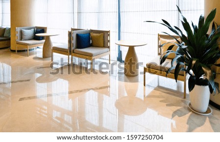 Empty chair and table on office lobby.