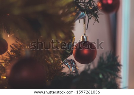 Christmas balls and gift on the tree