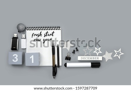 fresh start, new year. 31 december date, notebook, Christmas decor, stationery, pen, pencil, office supplies. new year's concept in office, University, school. Creative idea design.