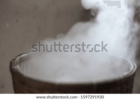 White smoke from steam glutinous rice in countryside kitchen. Soft picture