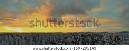Panoramic scene of sunset in São Paulo, Brazil. Great landscape. Sunset's scenary. Explosion of colors in the sky, 
