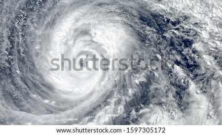 Eye of the Hurricane. Hurricane on Earth. Typhoon over planet Earth.. Category 5 super typhoon approaching the coast. View from outer space. (Elements of this image furnished by NASA) Royalty-Free Stock Photo #1597305172