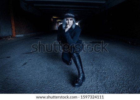 Dark blonde gothic girl with witch hat