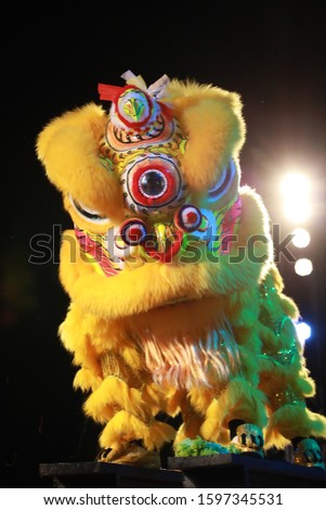 Yellow chinese lion dance performance