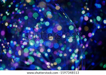 a blurry colorful light with black background in the christmas