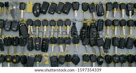 duplicates of keys of car in the wall of a locksmith's shop to be able to make the copies Royalty-Free Stock Photo #1597354339
