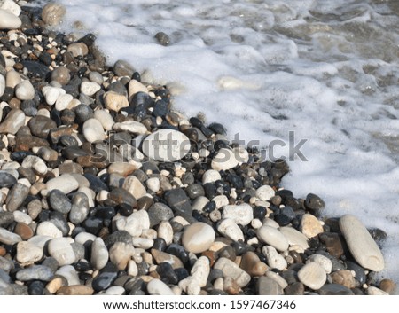 Words on pebble stones – motivational concept slogan – word sea