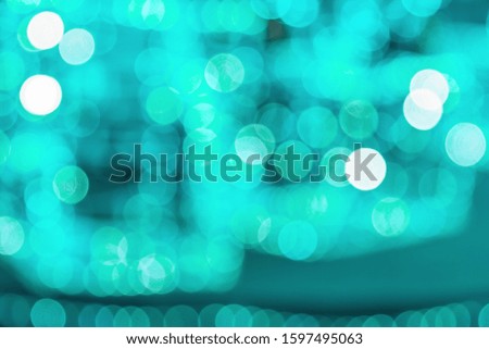 New Year and Christmas decorations with lights, abstract background with bokeh of trendy Aqua Menthe color, copy space