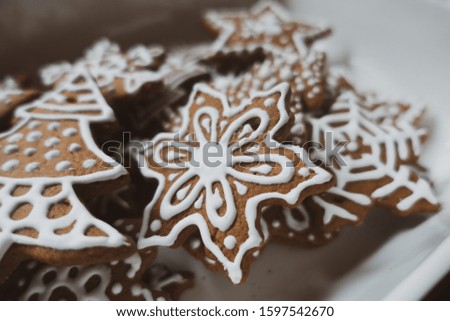 Christmas gingerbread cookies with icing. Christmas tree cookies flat lay. Close up