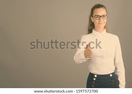 Portrait of young beautiful businesswoman with hair tied