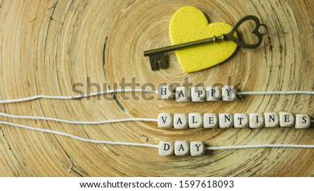 The  text wood cubes image for valentines day content.