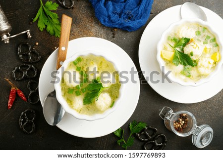 Fresh soup with chicken meat balls in bowl