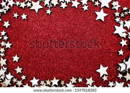 Christmas star frame over on red glitter background