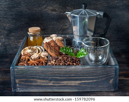 Coffee grains, honey, sugar and spices in a wooden box vintage
